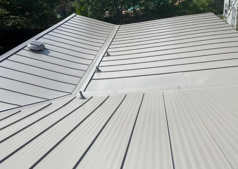 Solar attic fan installed on a metal roof for Roof Ventilation in West Carrollton